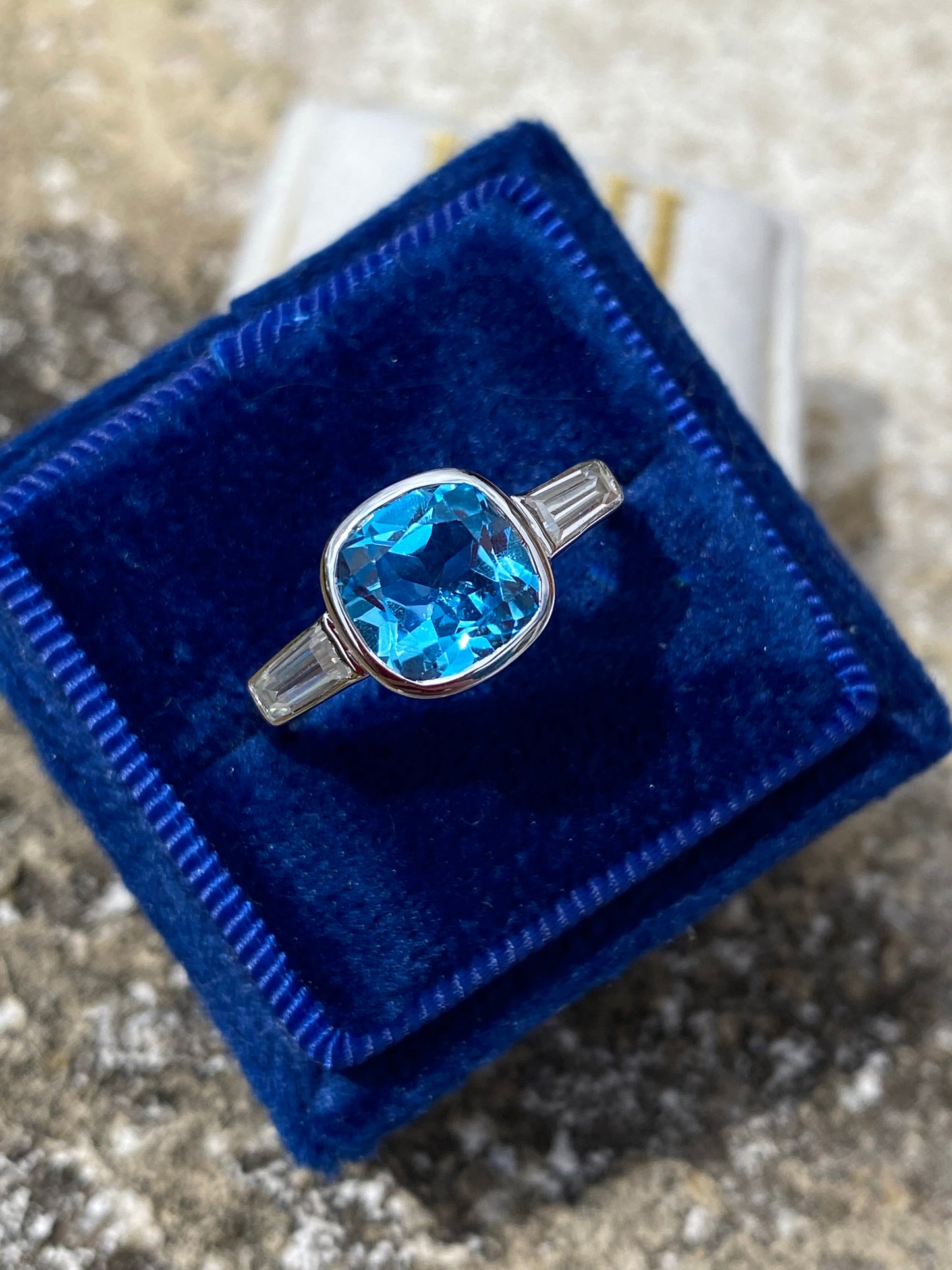 2.33 Carat Cushion Cut Blue Topaz and Moissanite Three Stone Ring