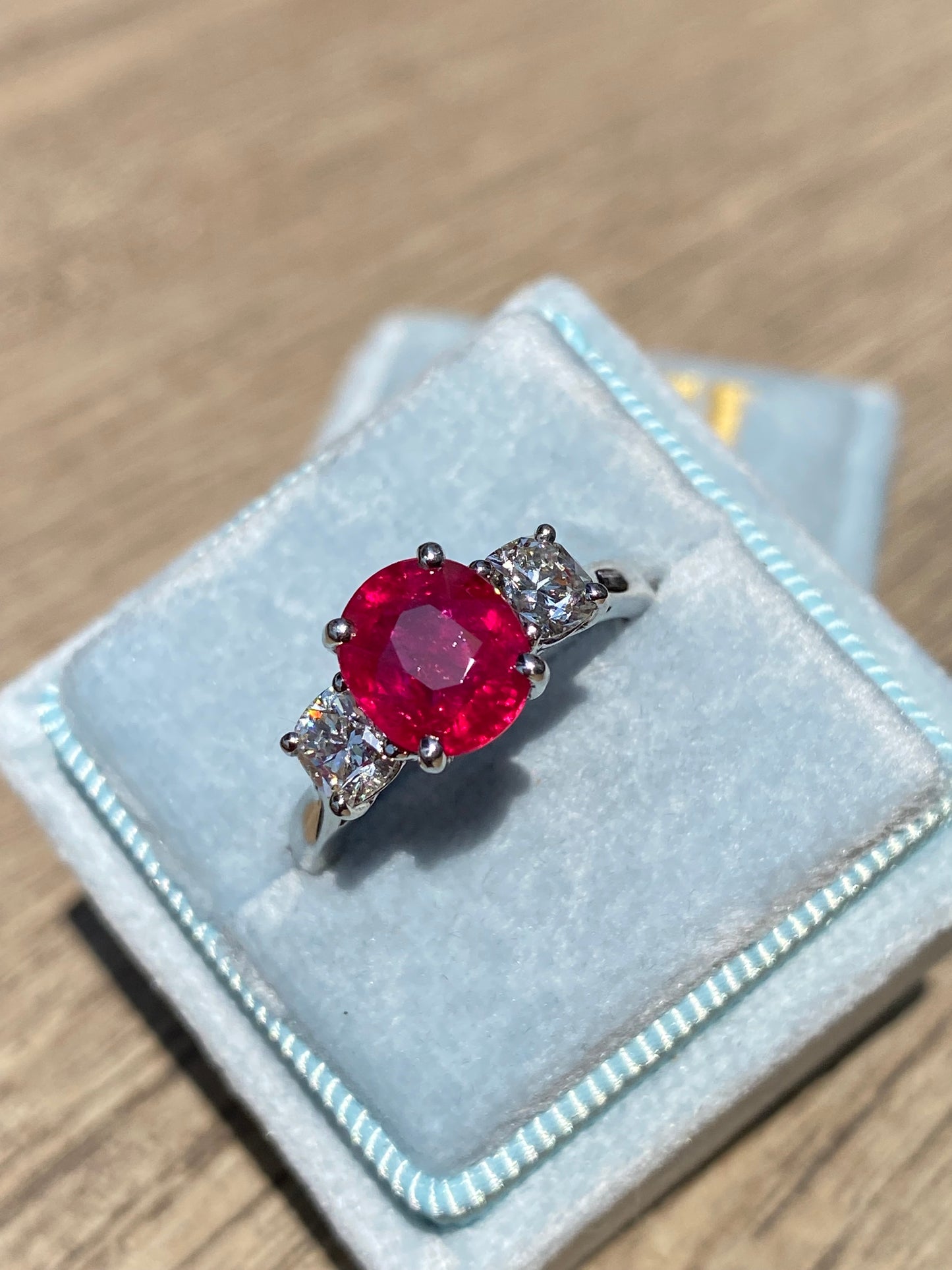 2.41 Carat Oval Ruby and Natural Diamond Three-Stone Engagement Ring in Platinum