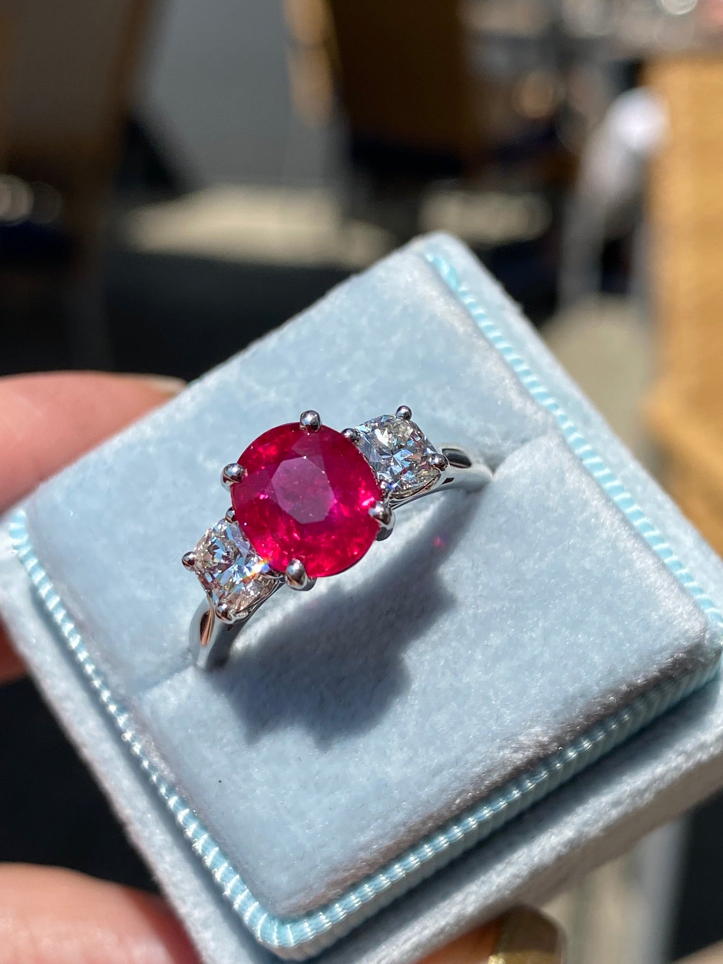 2.41 Carat Oval Ruby and Natural Diamond Three-Stone Engagement Ring in Platinum