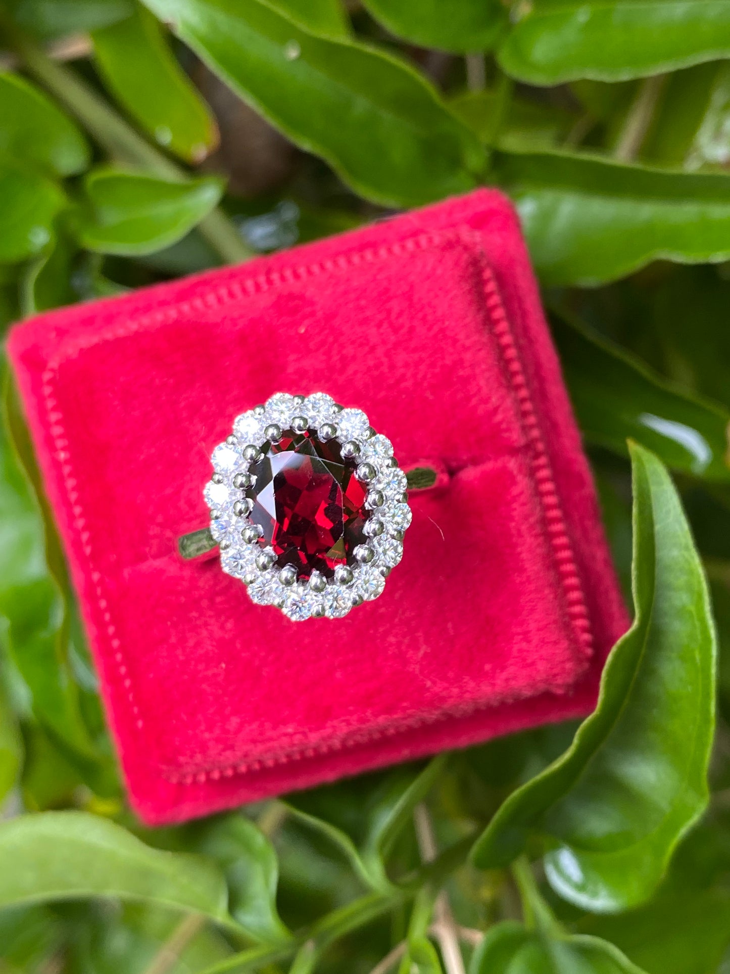 2.33 CTW Oval Cut Garnet and Moissanite Halo Cocktail Ring