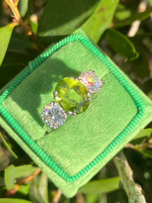 2.57 Carat Peridot and 1.84 Carat Moissanite Three Stone Ring