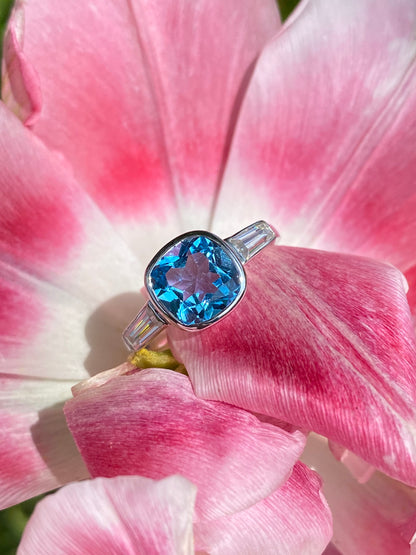 2.33 Carat Cushion Cut Blue Topaz and Moissanite Three Stone Ring