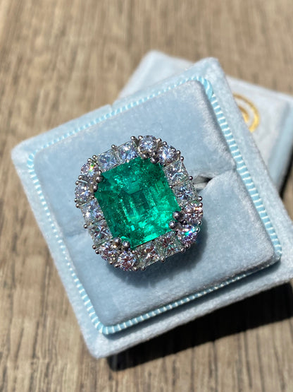 5.92 Carat Emerald Cut Colombian Emerald and Diamond Halo Ring in Platinum