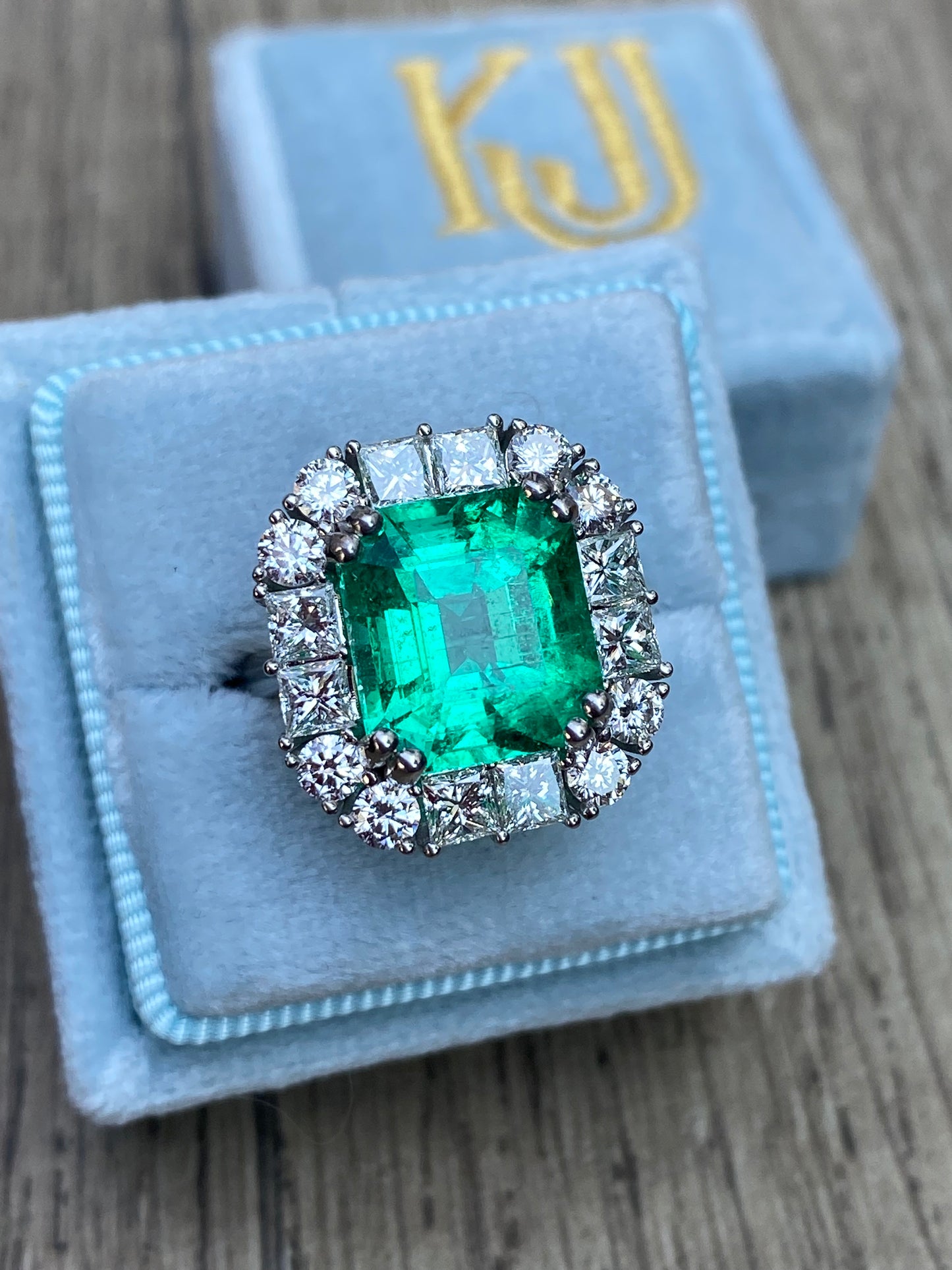 5.92 Carat Emerald Cut Colombian Emerald and Diamond Halo Ring in Platinum