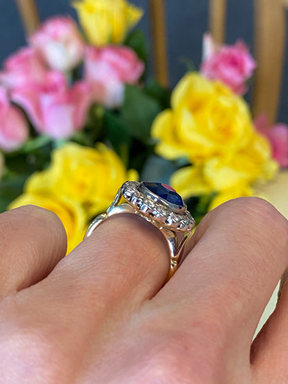 5.35 Carat Blue Ceylon Sapphire and Diamond Halo Ring in 18ct Gold