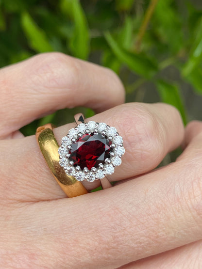 2.33 CTW Oval Cut Garnet and Moissanite Halo Cocktail Ring