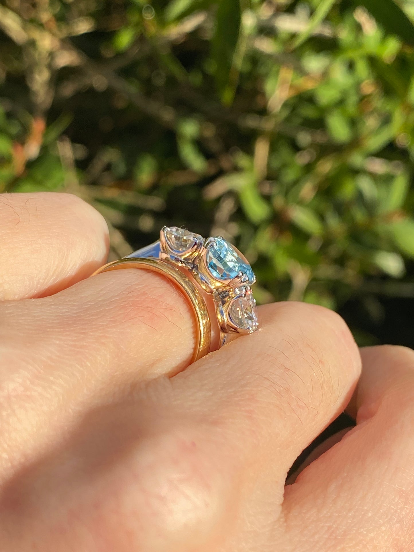 2.57 Carat Blue Topaz and 1.84 Carat Moissanite Three Stone Ring