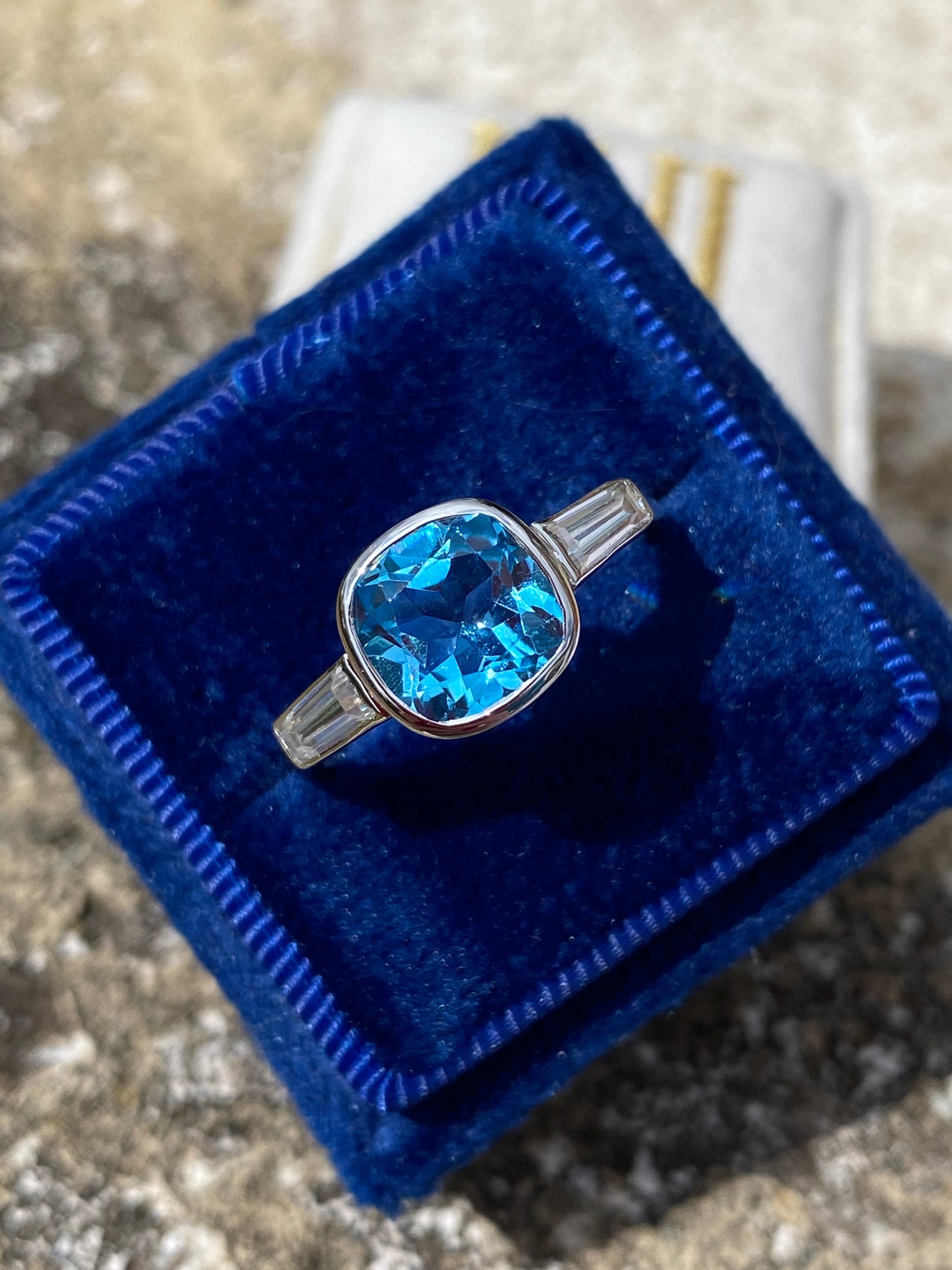 2.33 Carat Cushion Cut Blue Topaz and Moissanite Three Stone Ring