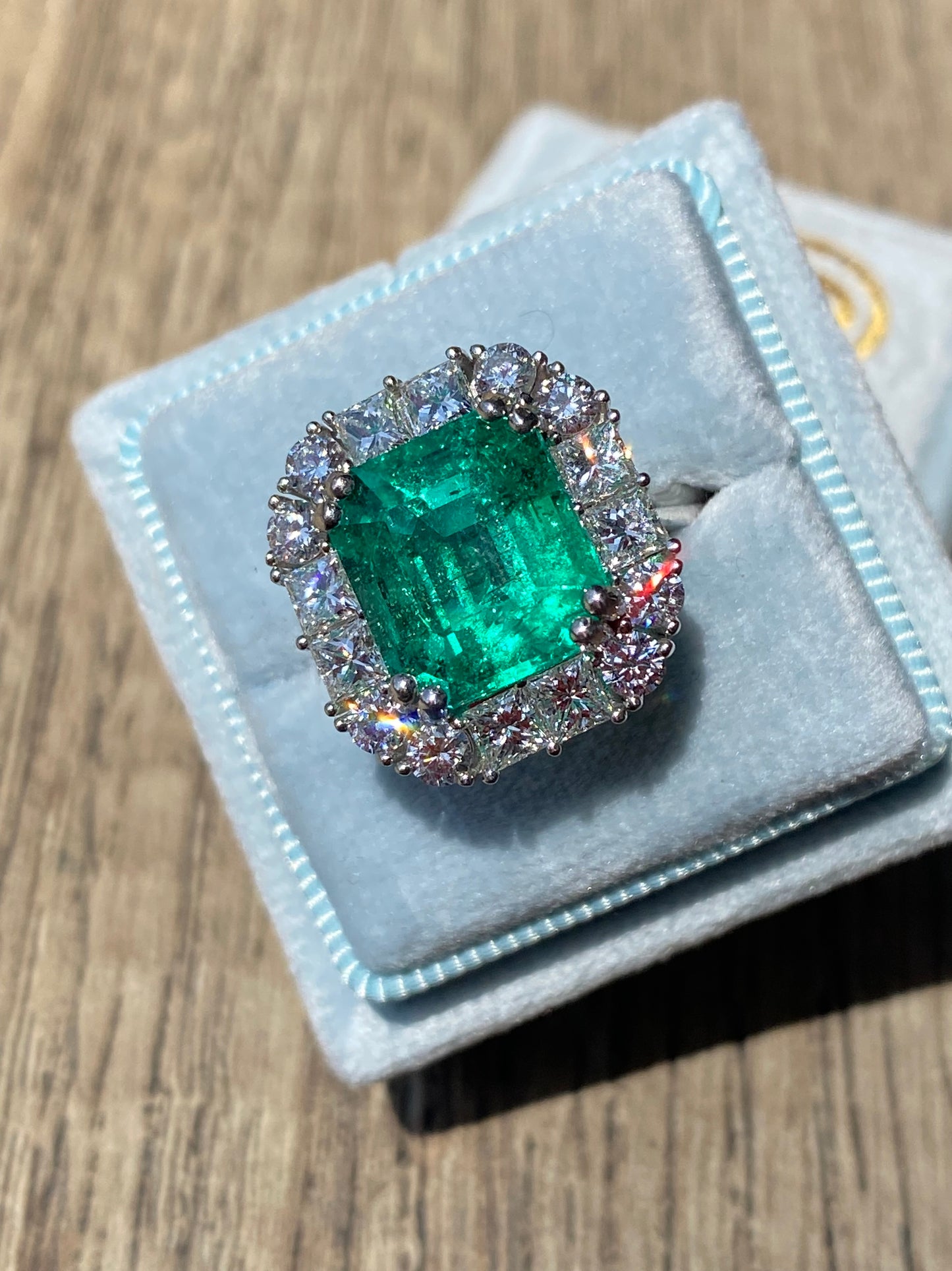 5.92 Carat Emerald Cut Colombian Emerald and Diamond Halo Ring in Platinum