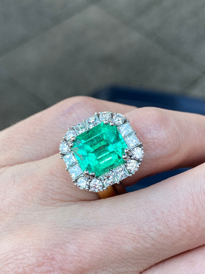 5.92 Carat Emerald Cut Colombian Emerald and Diamond Halo Ring in Platinum