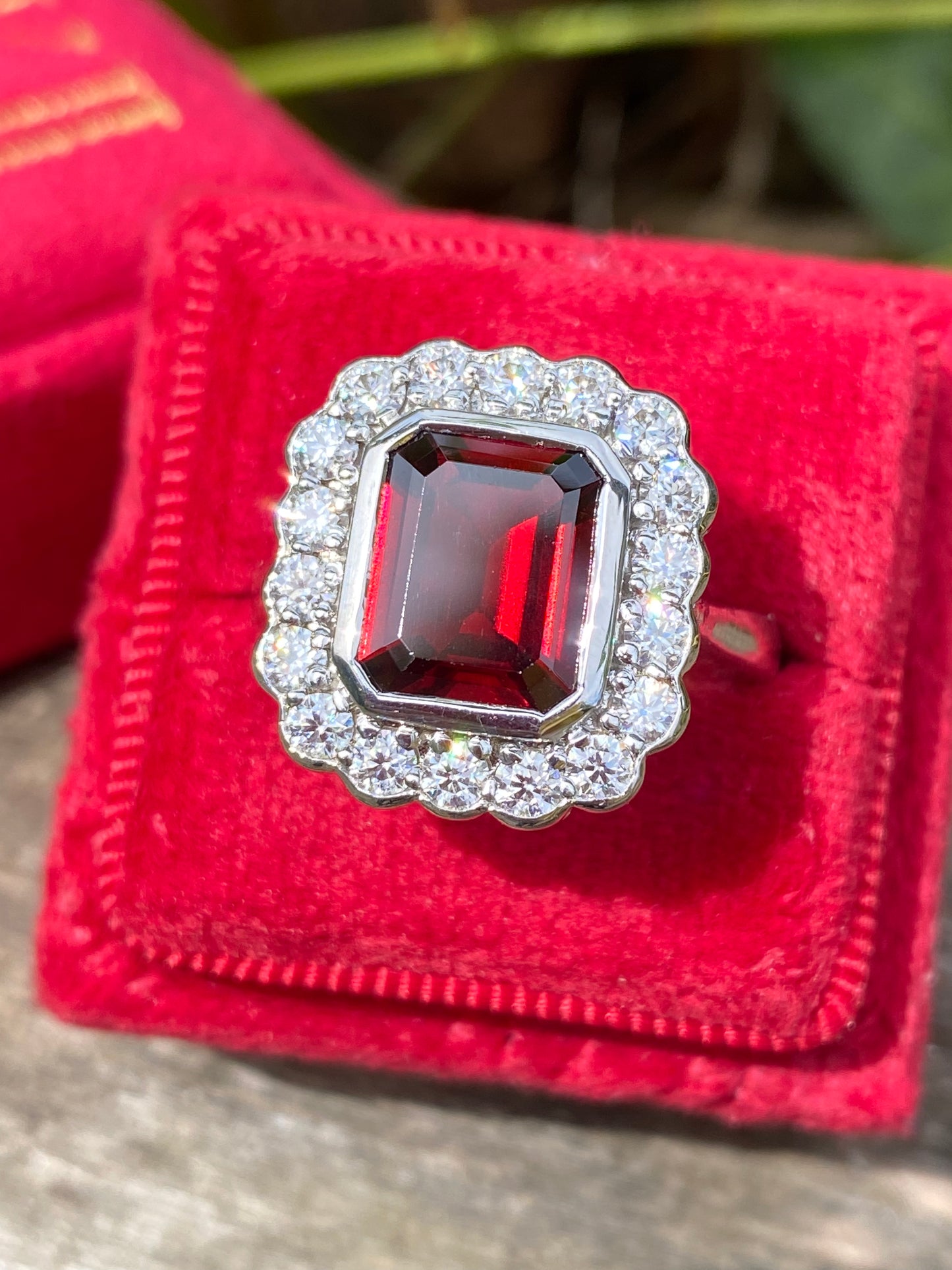 4.25 CTW Emerald Cut Garnet and Moissanite Halo Cocktail Ring in Sterling Silver