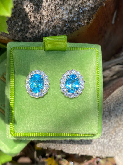 4.71 CTW Oval Cut Blue Topaz and Moissanite Earrings in Sterling Silver