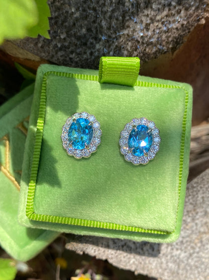 4.71 CTW Oval Cut Blue Topaz and Moissanite Earrings in Sterling Silver