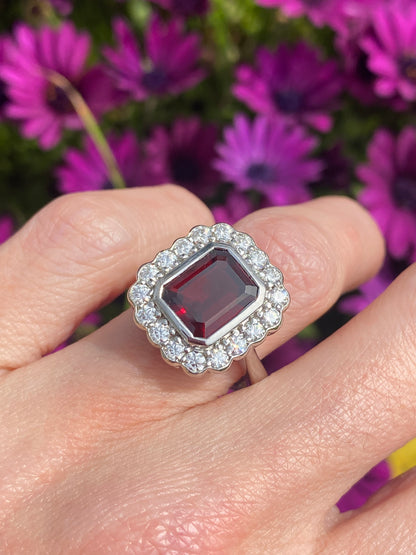 4.25 CTW Emerald Cut Garnet and Moissanite Halo Cocktail Ring in Sterling Silver