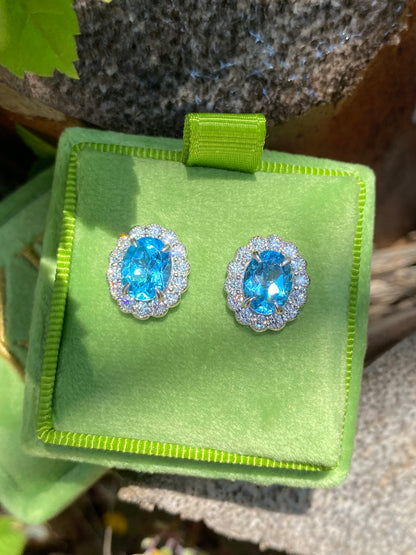 4.71 CTW Oval Cut Blue Topaz and Moissanite Earrings in Sterling Silver