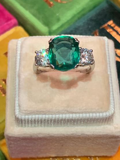 Emerald and diamond three stone ring