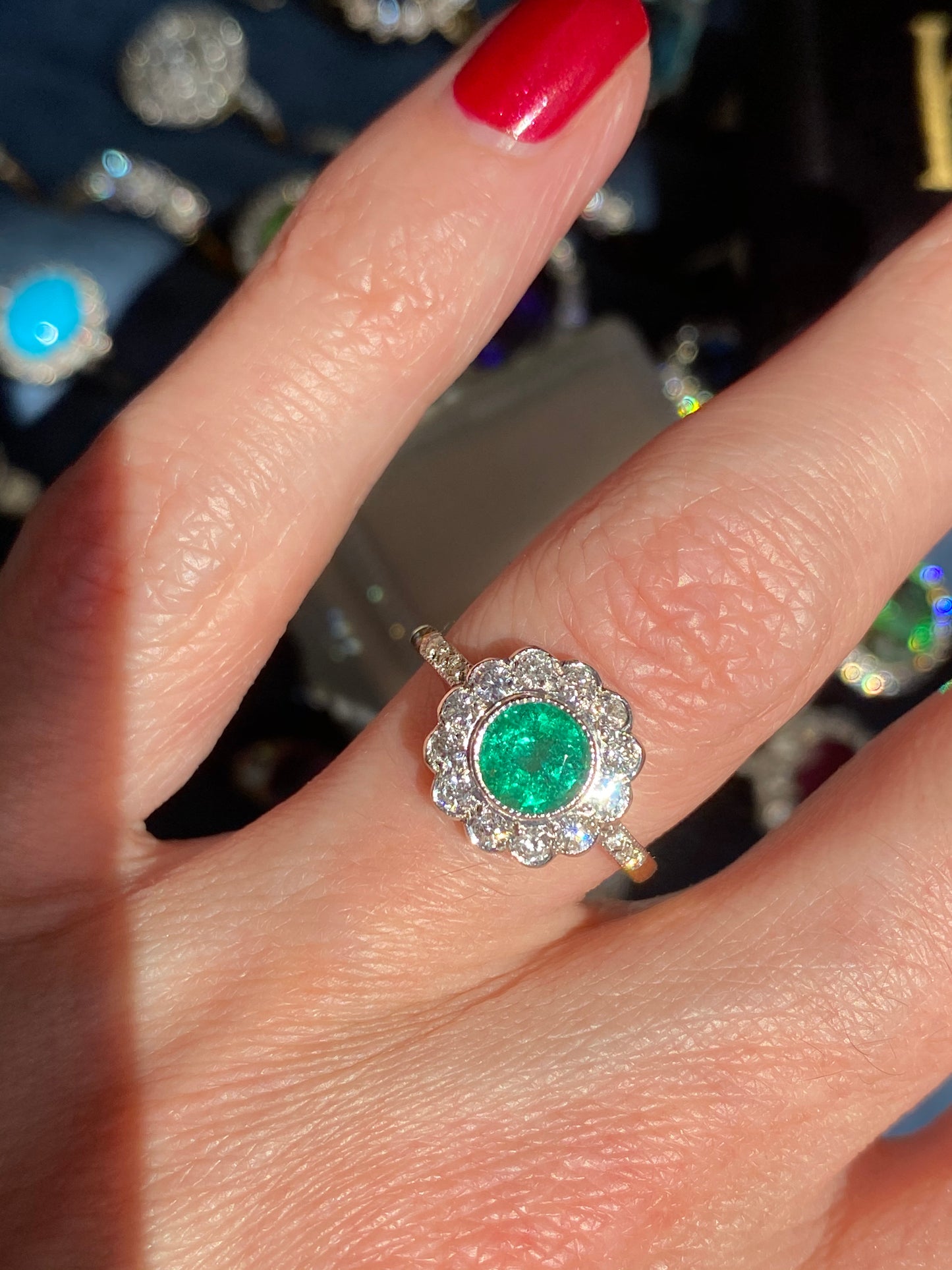 1.10 CTW Round Cut Emerald and Diamond Halo Engagement Ring in 18ct Gold