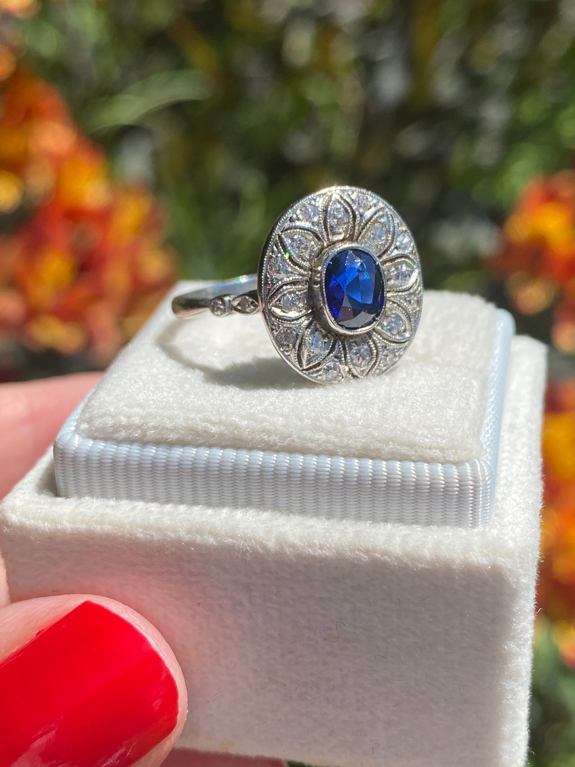 Antique Art Deco Oval Blue Sapphire and Diamond Halo Engagement Ring in Platinum 