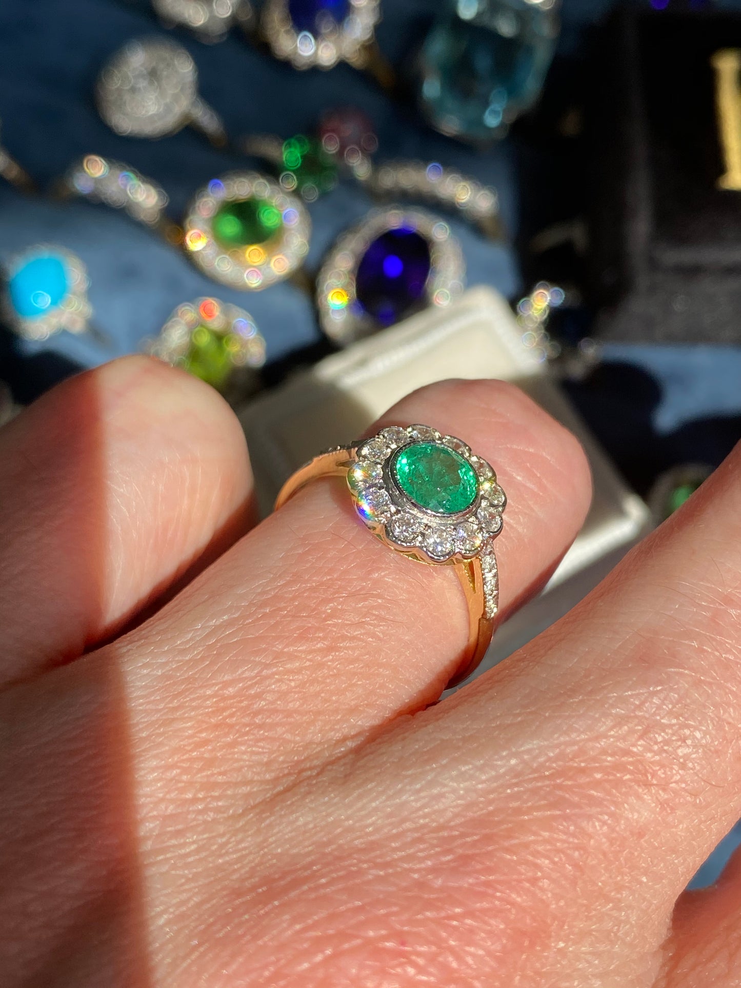 1.10 CTW Round Cut Emerald and Diamond Halo Engagement Ring in 18ct Gold