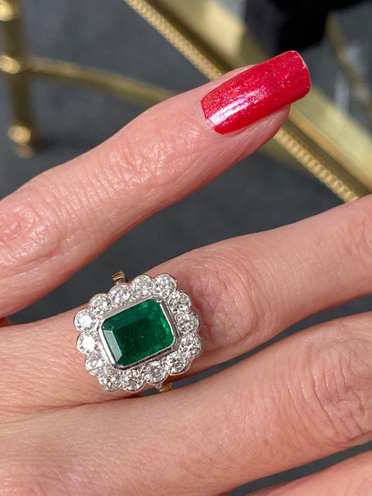 Emerald and Diamond Halo Antique Style engagement ring 