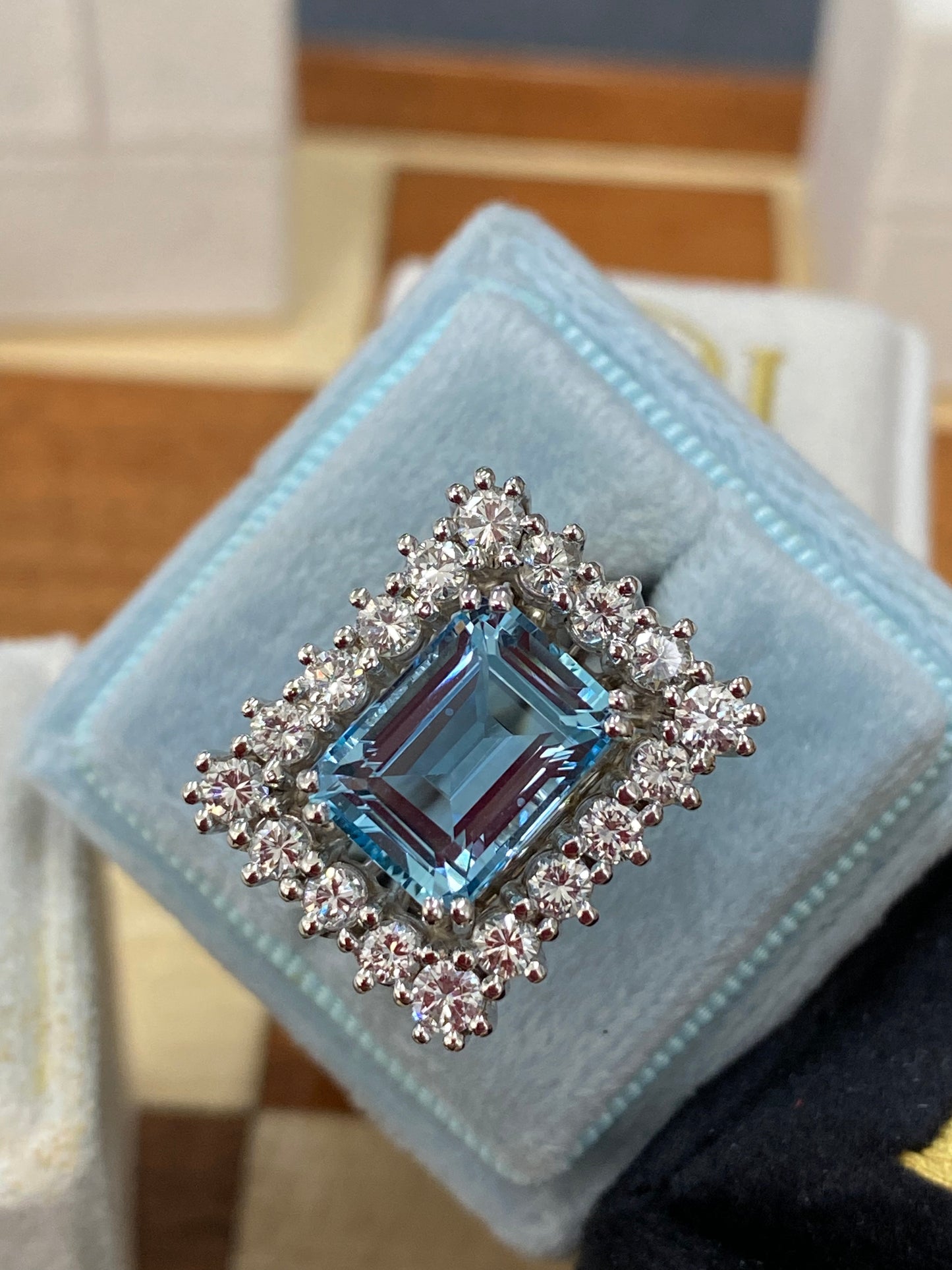 Emerald cut East West Aquamarine and Diamond Halo Cocktail Ring in Platinum 