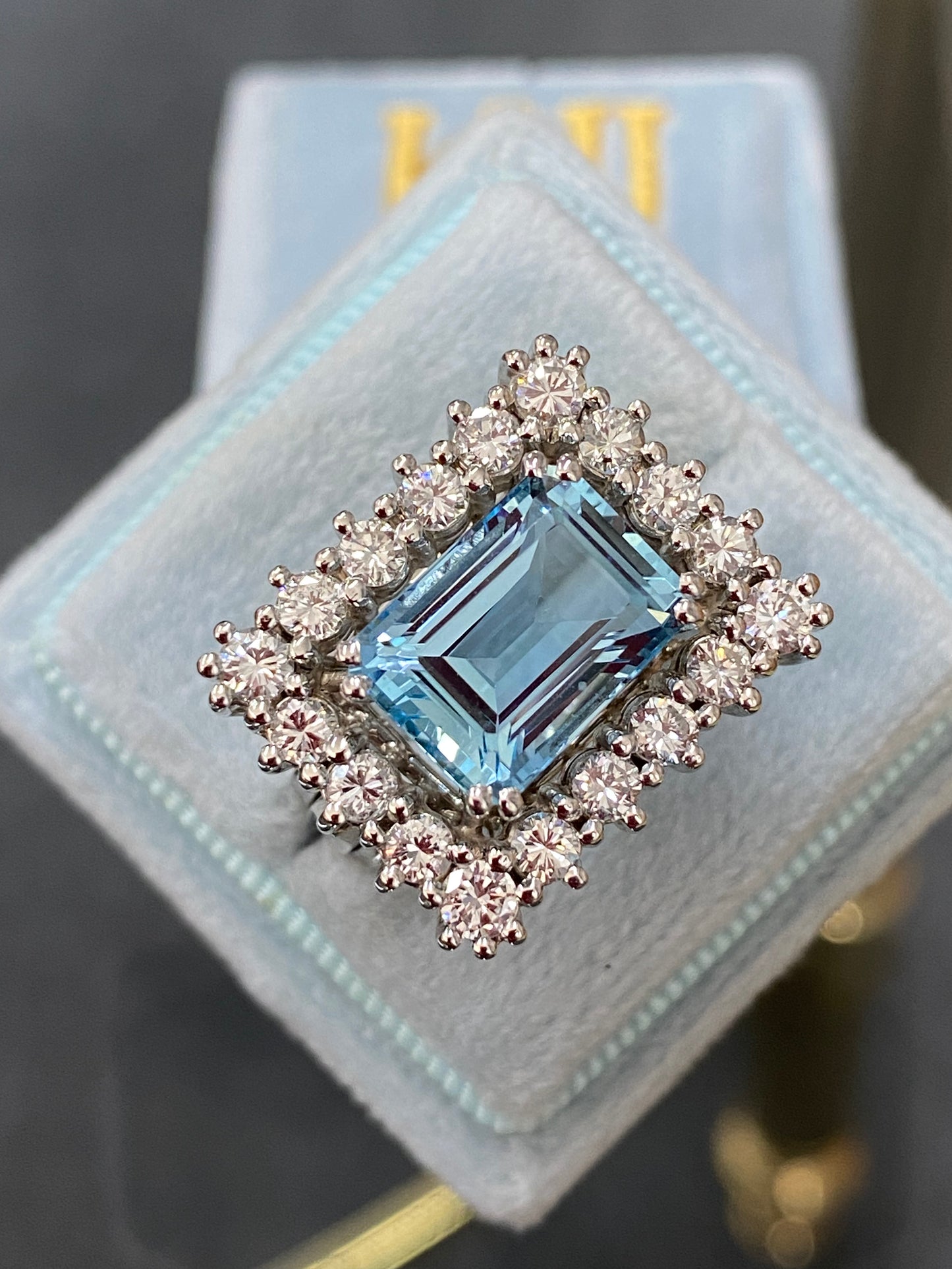 Emerald cut East West Aquamarine and Diamond Halo Cocktail Ring in Platinum 