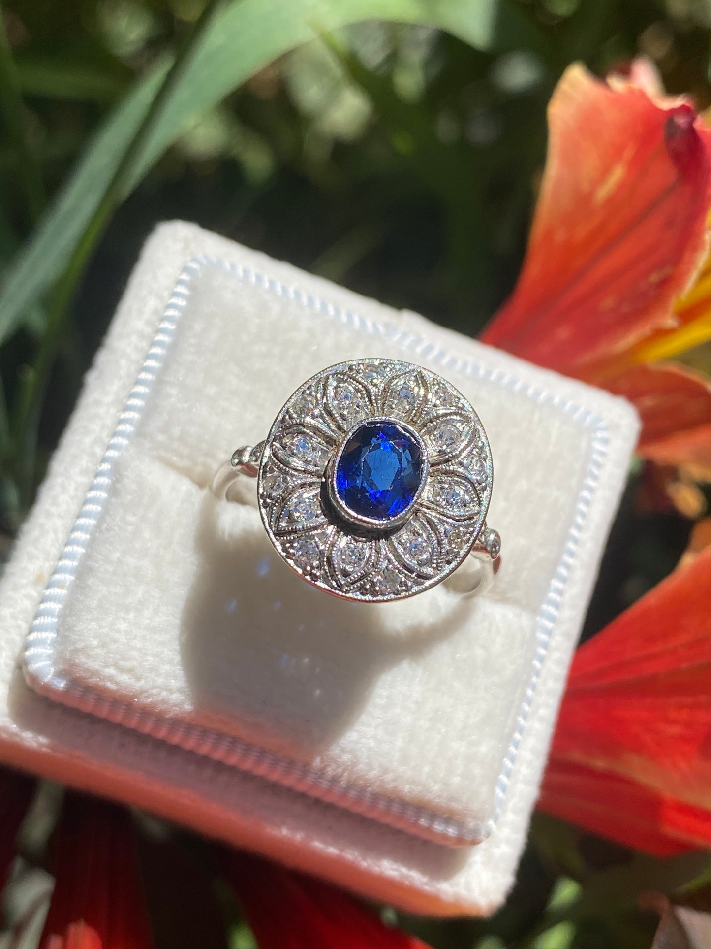 Antique Art Deco Oval Blue Sapphire and Diamond Halo Engagement Ring in Platinum 