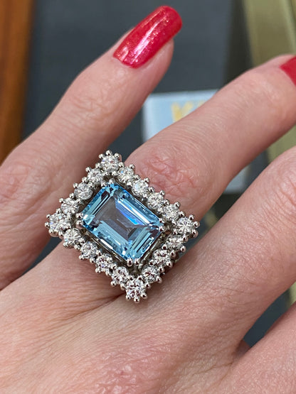 Emerald cut East West Aquamarine and Diamond Halo Cocktail Ring in Platinum 