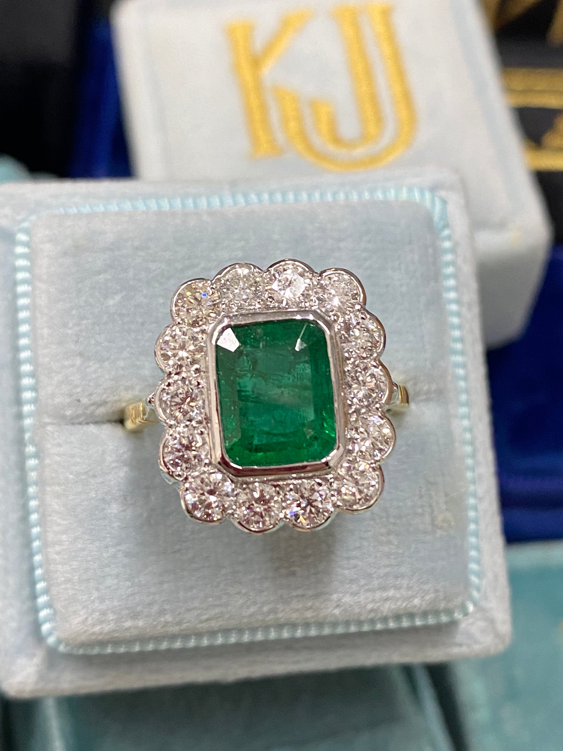 Emerald and Diamond Halo Antique Style engagement ring 