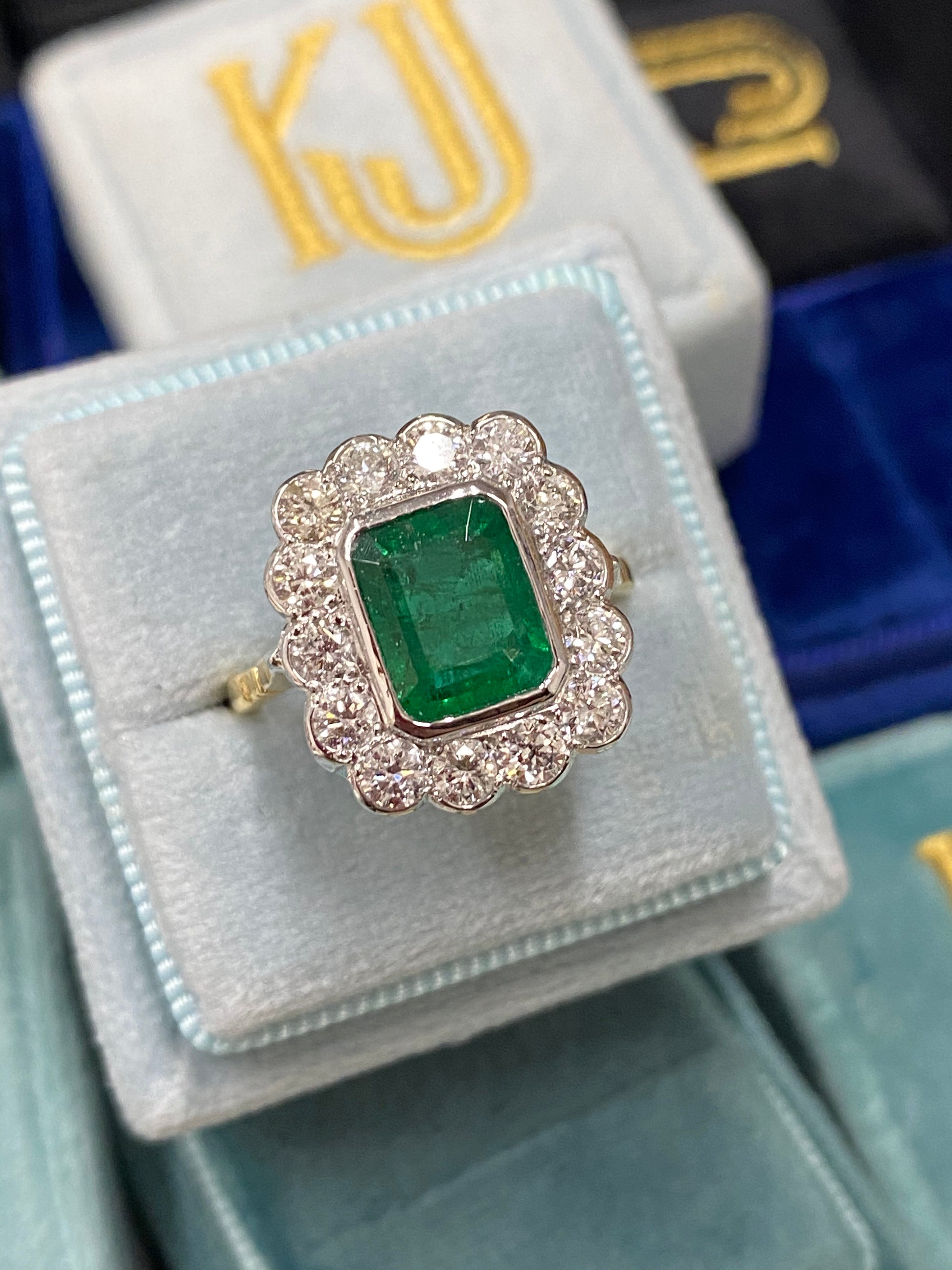 Emerald and Diamond Halo Antique Style engagement ring 