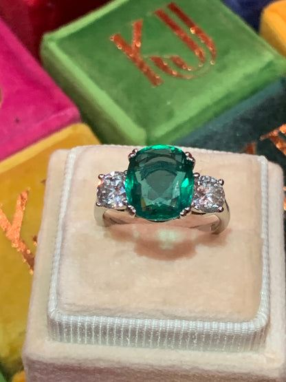 Emerald and diamond three stone ring