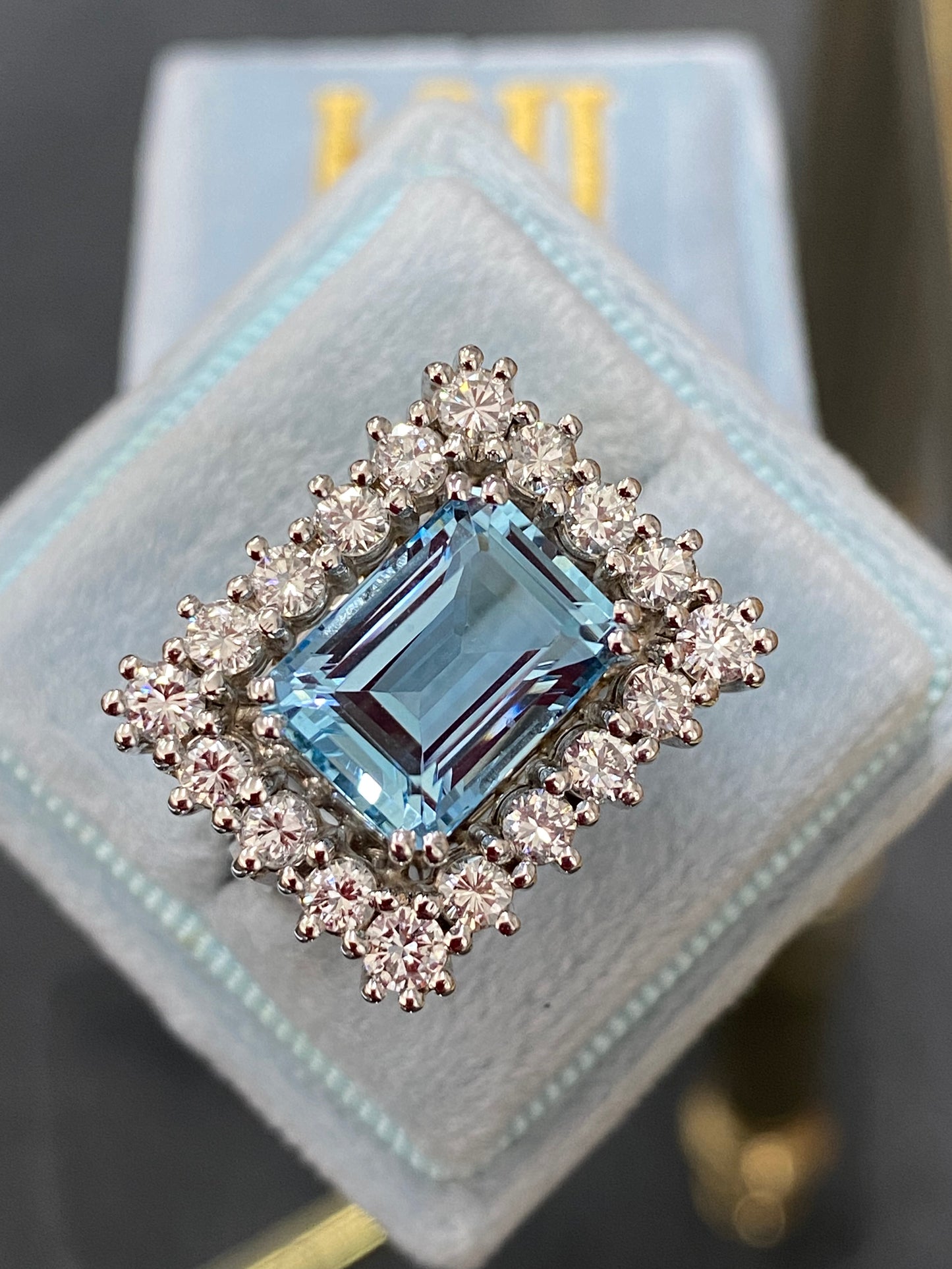 Emerald cut East West Aquamarine and Diamond Halo Cocktail Ring in Platinum 