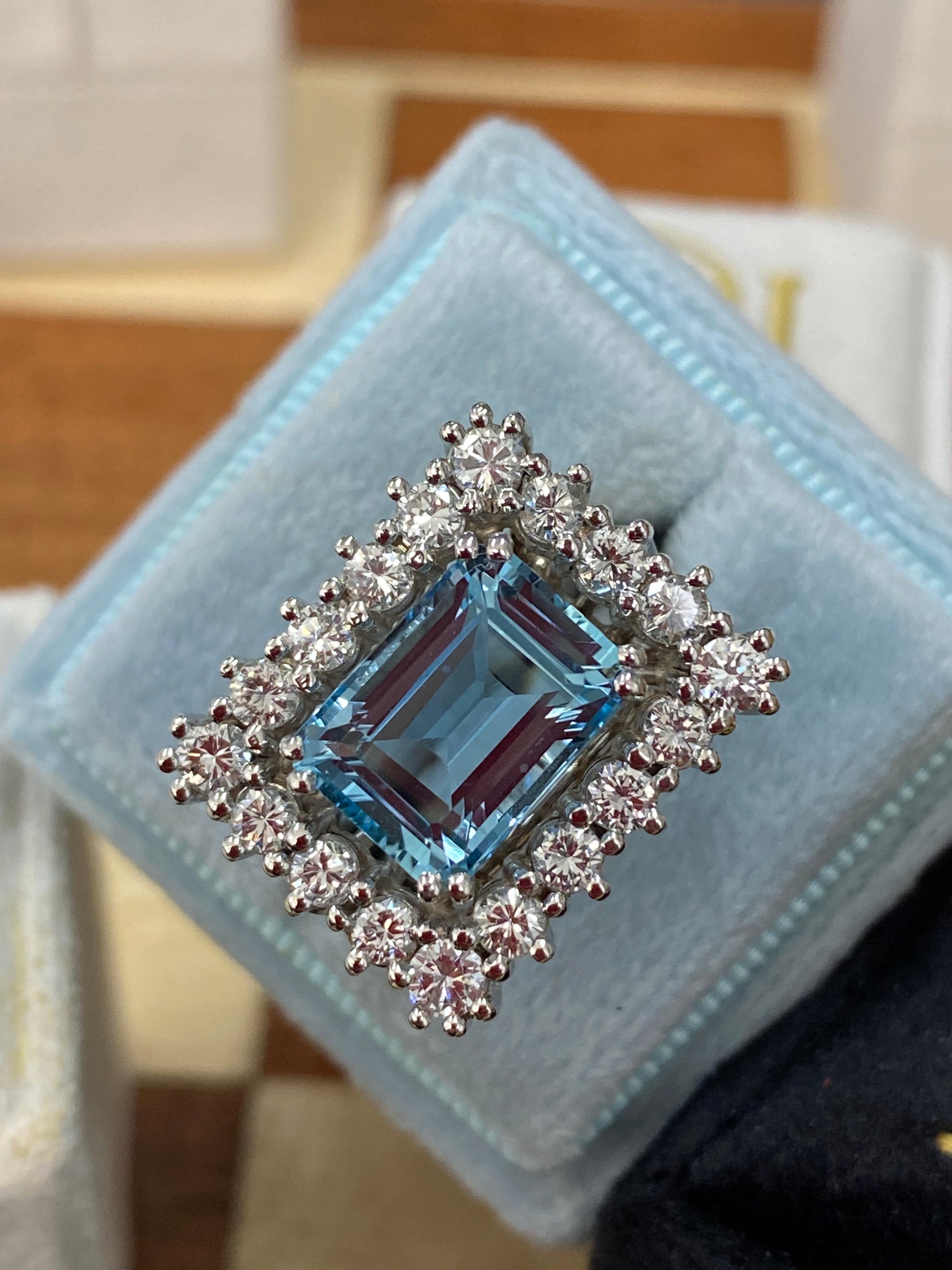 Emerald cut East West Aquamarine and Diamond Halo Cocktail Ring in Platinum 