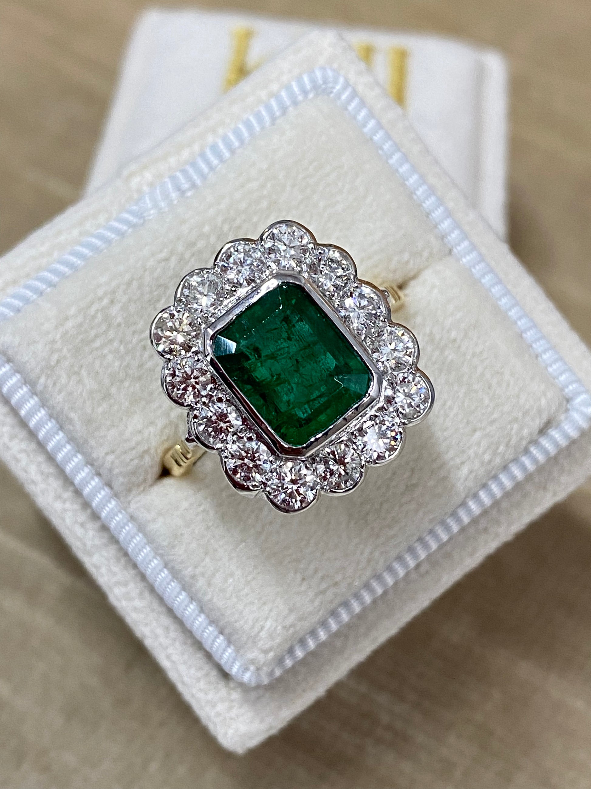 Emerald and Diamond Halo Antique Style engagement ring 