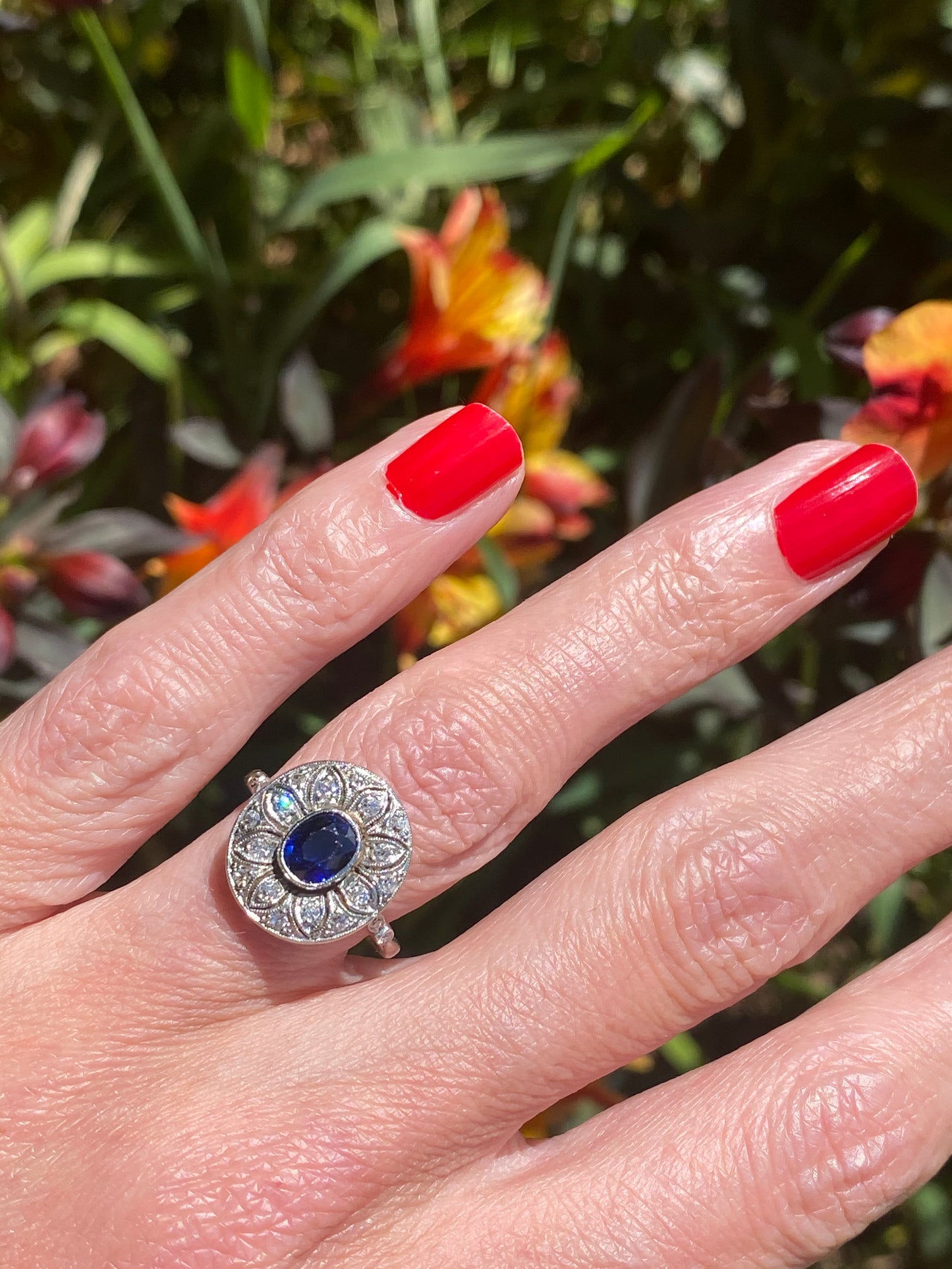 Antique Art Deco Oval Blue Sapphire and Diamond Halo Engagement Ring in Platinum 