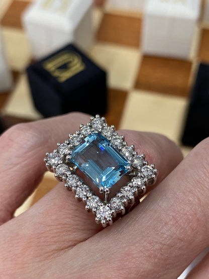 Emerald cut East West Aquamarine and Diamond Halo Cocktail Ring in Platinum 