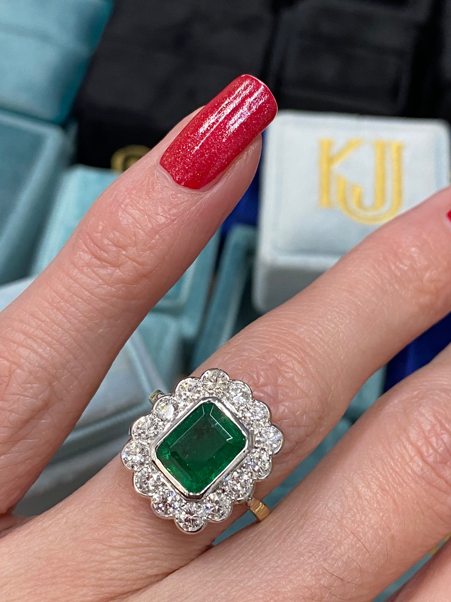 Emerald and Diamond Halo Antique Style engagement ring 