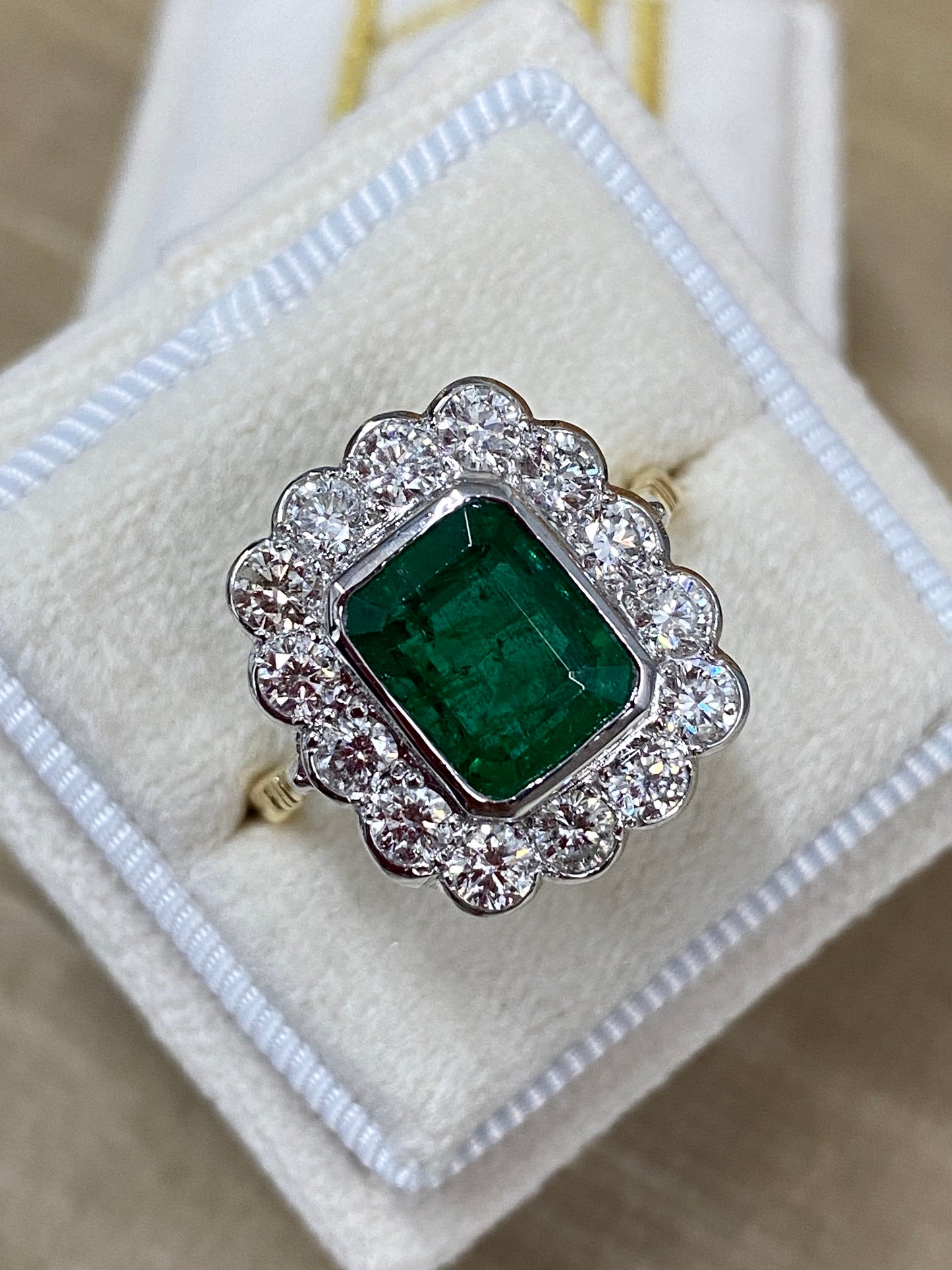 Emerald and Diamond Halo Antique Style engagement ring 