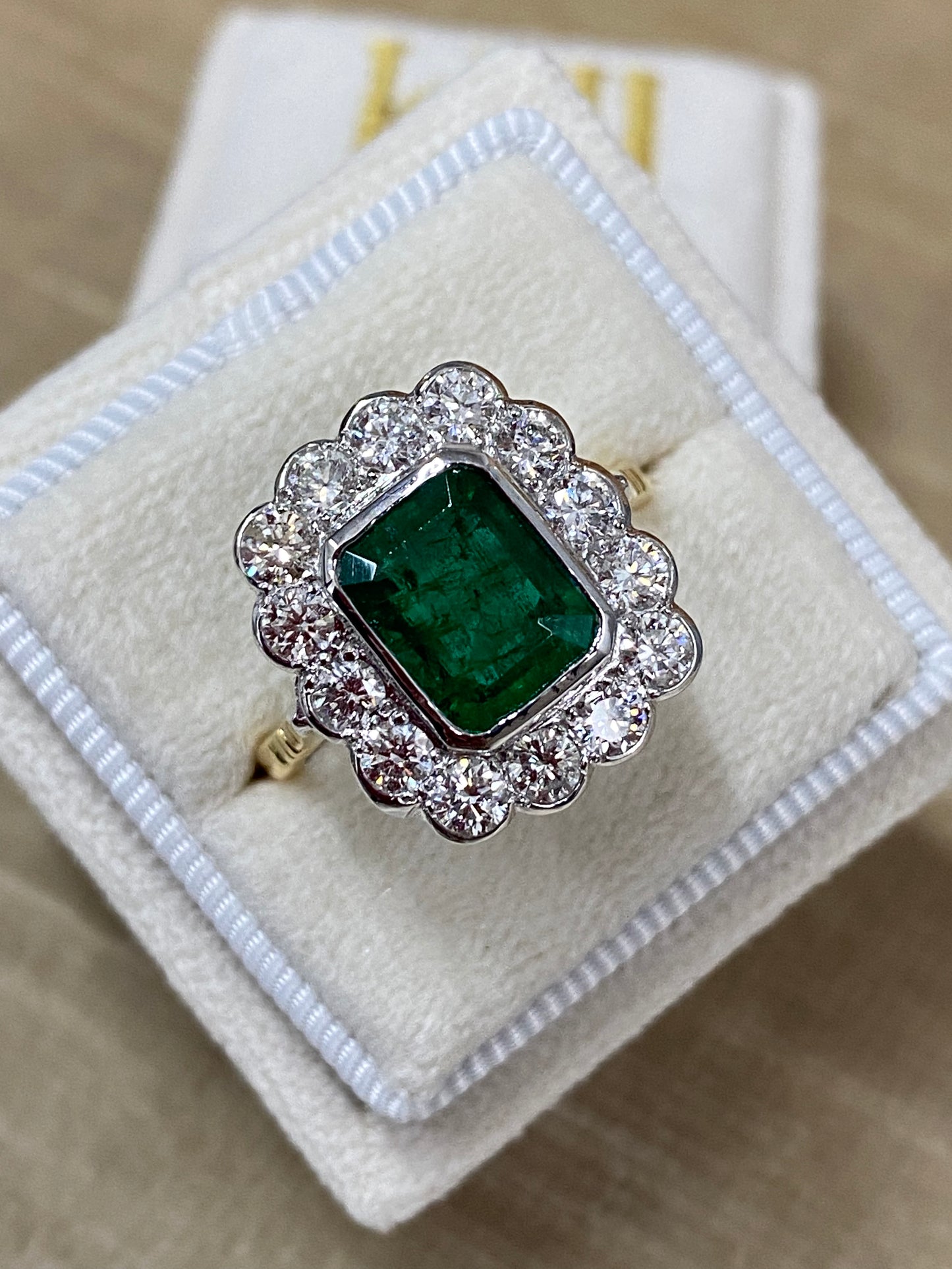 Emerald and Diamond Halo Antique Style engagement ring 