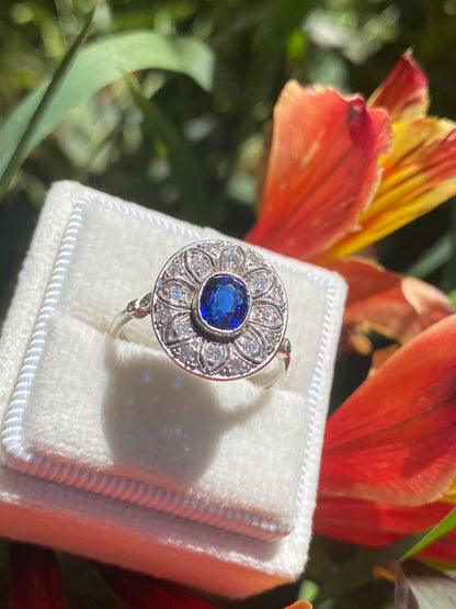 Antique Art Deco Oval Blue Sapphire and Diamond Halo Engagement Ring in Platinum 