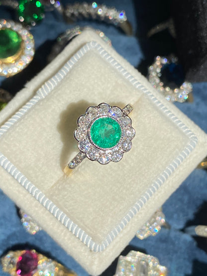 1.10 CTW Round Cut Emerald and Diamond Halo Engagement Ring in 18ct Gold