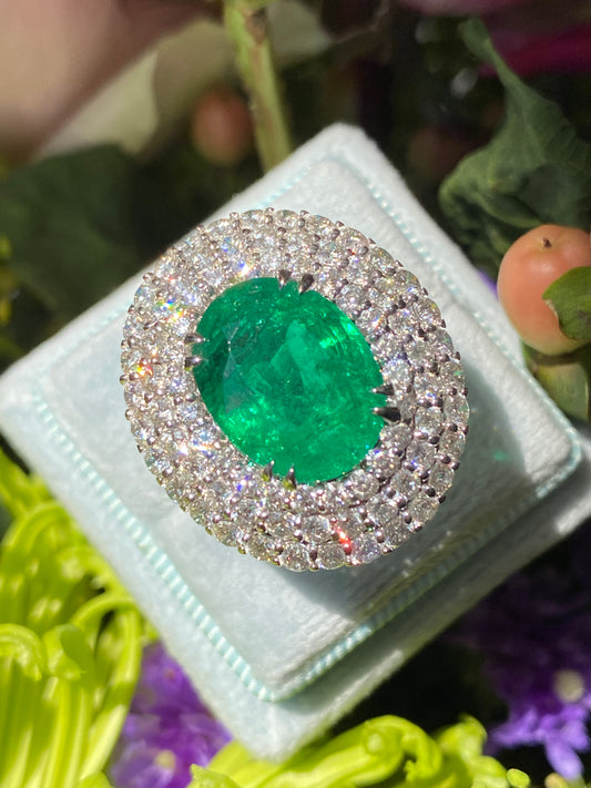 6.98 Carat Oval Cut Emerald and Diamond Triple Halo Ring in Platinum