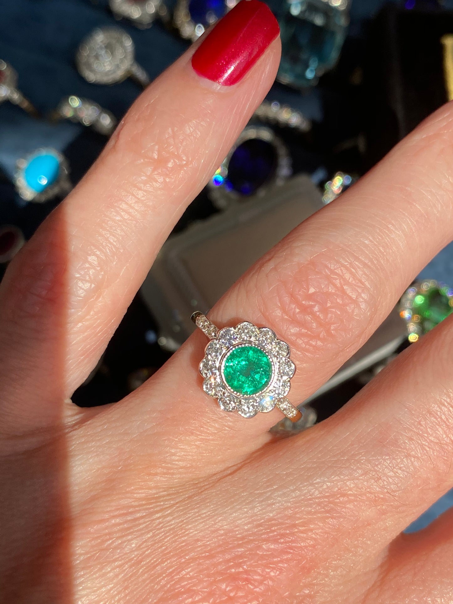 1.10 CTW Round Cut Emerald and Diamond Halo Engagement Ring in 18ct Gold